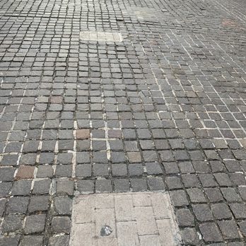 New York Walking Tours - Wall Street pavers. Wood grain simulated the actual wall from 1700s designed to protect from the Indian inhabitants of the island. - Walking Tours Near Me - New York, New York