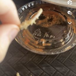 a person holding a piece of food a person holding a piece of food
