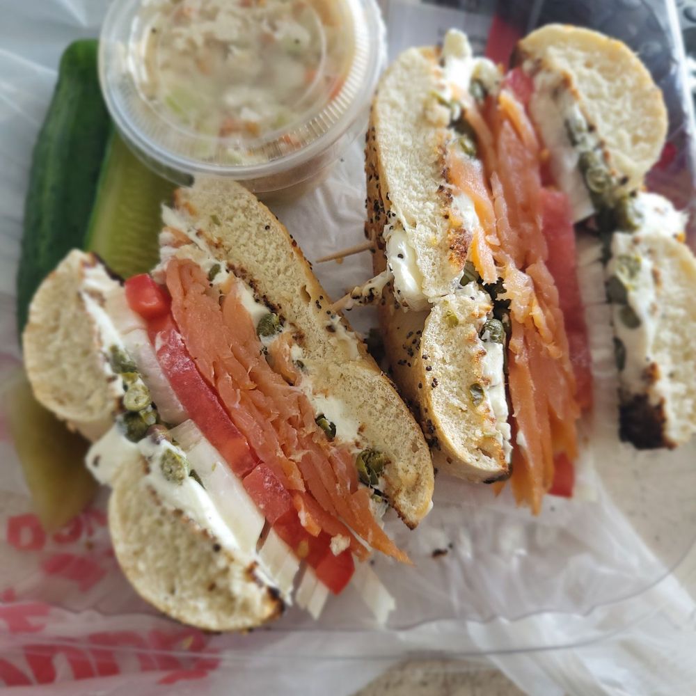 Everything Bagel with Salmon, tomato, cream cheese, capers, and onion with slaw on the side. Everything Bagel with Salmon, tomato, cream cheese, capers, and onion with slaw on the side.