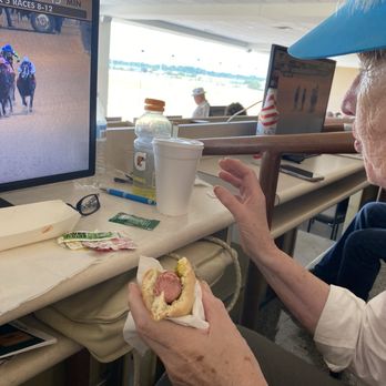 Lone Star Park - Enjoying a hot dog - Venues & Event Spaces Near Me - Grand Prairie, Texas