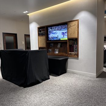 The Centurion Lounge - a flat screen tv in the center of the room - Airport Lounges Near Me - Dallas, Texas The Centurion Lounge - a flat screen tv in the center of the room - Airport Lounges Near Me - Dallas, Texas