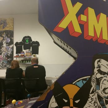 8-Bit Aleworks - Bar seating area. Classic X-men arcade machine. Bring your quarters. - Bars Near Me - Avondale, Arizona