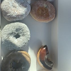 Half dozen...raspberry filled, vanilla cream, chocolate coconut, blueberry, and half a chocolate glazed