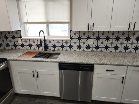 Kitchen remodel - This remodel, completed in 2024, was a complete tear down and replace due to water damage.
All steps were carefully considered to ensure a completely safe and clean environment while giving the customer their own personal flair with custom tile and fixture choices. Custom trim work, personalized kitchen island, new appliances and fixtures.