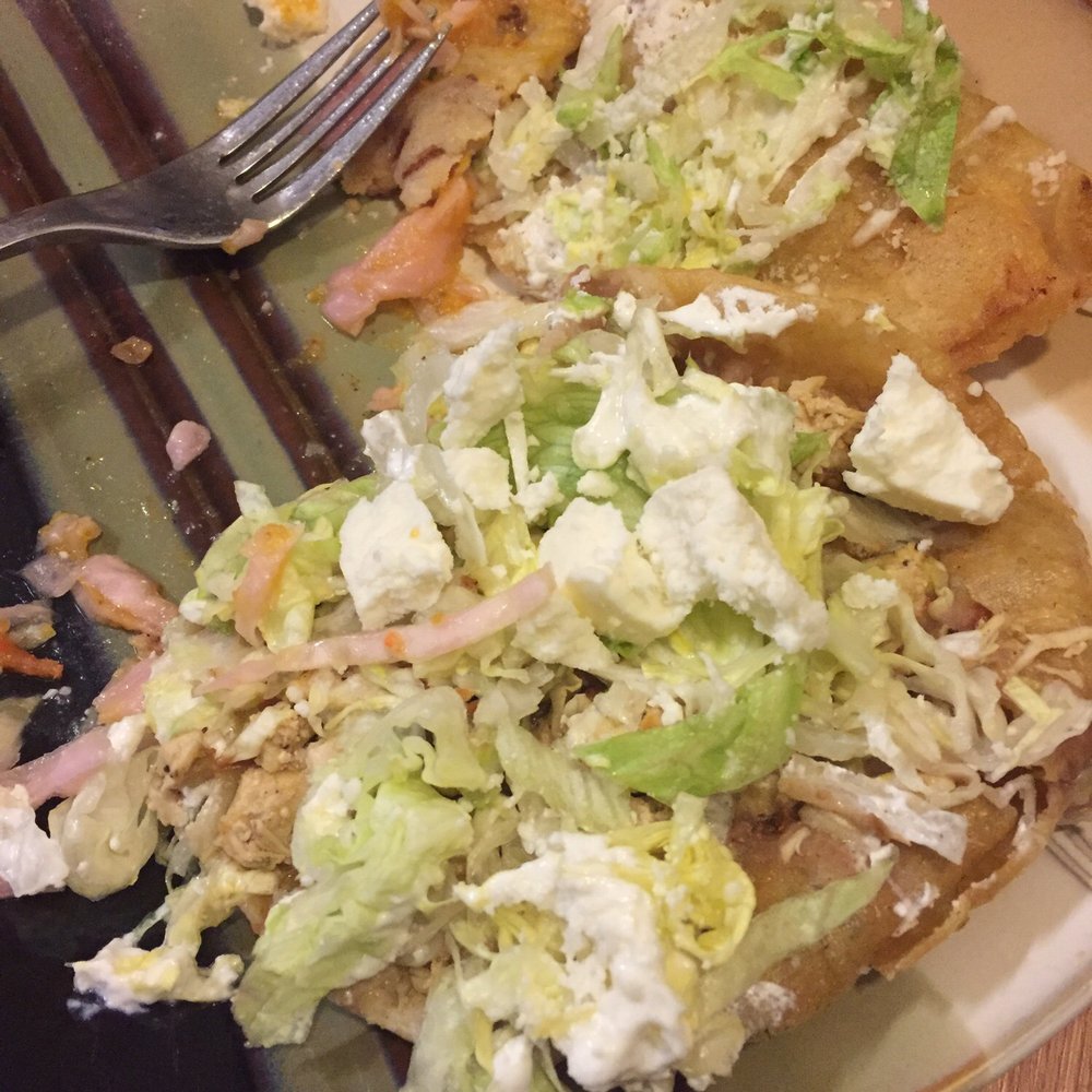 Empanadas and tostadas, half eaten. Empanadas and tostadas, half eaten.