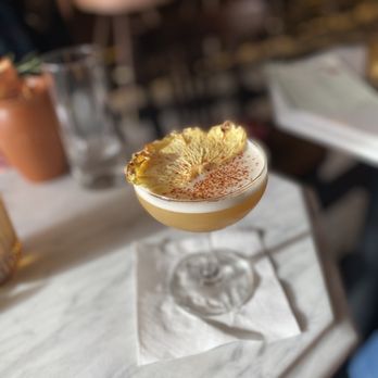 Time Will Tell - a cocktail with a pineapple garnish - Cocktail Bars Near Me - Detroit, Michigan