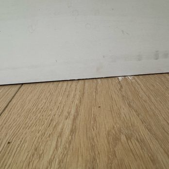 Floor One - White caulk stuck in floor - Flooring Near Me - Mesa, Arizona