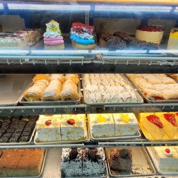 MC Bakery and Coffeeshop II - a display of cakes and pastries - Coffee & Tea Near Me - The Bronx, New York MC Bakery and Coffeeshop II - a display of cakes and pastries - Coffee & Tea Near Me - The Bronx, New York
