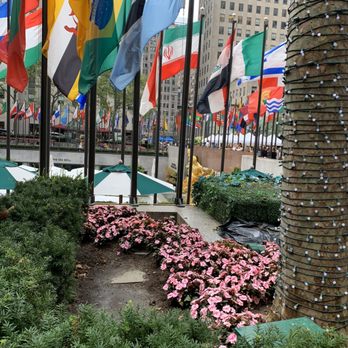 Rockefeller Center - An array of flags blowing in the wind @ Rockefeller Center In NYC August 2019 - Shopping Centers Near Me - New York, New York Rockefeller Center - An array of flags blowing in the wind @ Rockefeller Center In NYC August 2019 - Shopping Centers Near Me - New York, New York