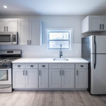 Terraform Construction - a kitchen with white cabinets and stainless steel appliances - General Contractors Near Me - Brooklyn, New York Terraform Construction - a kitchen with white cabinets and stainless steel appliances - General Contractors Near Me - Brooklyn, New York
