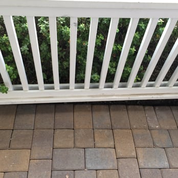 Mr. Pavers - Front porch. They laid the pavers unevenly, which caused the need to make all those uneven cuts by the wall. - Masonry/Concrete Near Me - San Ramon, California Mr. Pavers - Front porch. They laid the pavers unevenly, which caused the need to make all those uneven cuts by the wall. - Masonry/Concrete Near Me - San Ramon, California