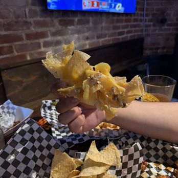 T. Boyles Tavern - Nachos stuck together. The black ink from the parchment paper are stuck to the chips. - Pubs Near Me - Pasadena, California T. Boyles Tavern - Nachos stuck together. The black ink from the parchment paper are stuck to the chips. - Pubs Near Me - Pasadena, California