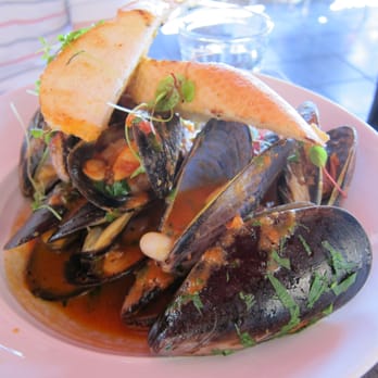 Armani Restaurant - STEAMED MUSSELS ~ Black Boston Bay mussels tossed in garlic rosetta sauce and served with garlic bread. - Middle Eastern Near Me - Parramatta, NSW