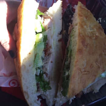 Kneaders Bakery & Cafe - Turkey bacon avocado on focaccia at an angle that will make you drool! - Bakeries Near Me - Saint George, Utah Kneaders Bakery & Cafe - Turkey bacon avocado on focaccia at an angle that will make you drool! - Bakeries Near Me - Saint George, Utah
