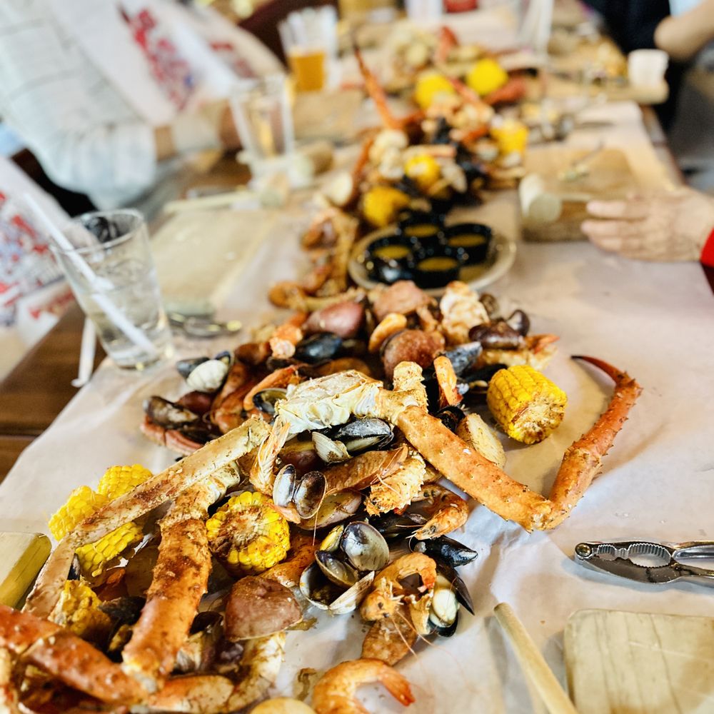 The Crab Pot Bellevue - a table full of seafood - Seafood Near Me - Bellevue, Washington The Crab Pot Bellevue - a table full of seafood - Seafood Near Me - Bellevue, Washington
