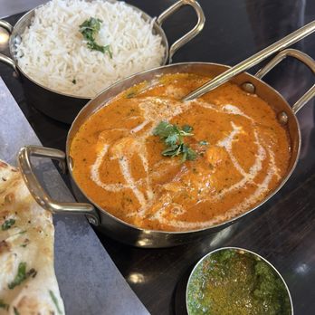 Megh Indian Cuisine - Butter chicken and side of rice - Indian Near Me - Flagstaff, Arizona Megh Indian Cuisine - Butter chicken and side of rice - Indian Near Me - Flagstaff, Arizona