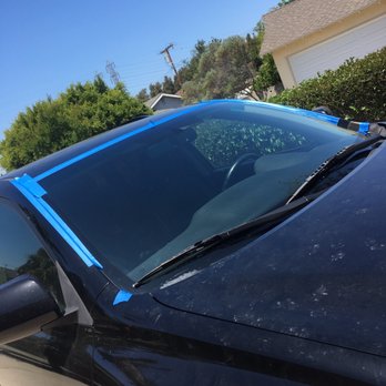 Sam's Auto Glass - Finished product- windshield replacement (temporarily taped to make sure it dries with a good seal). Lookin' good! - Auto Glass Services Near Me - Stanton, California
