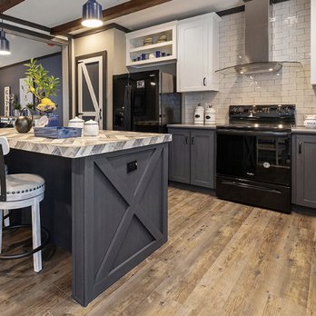 Elegant Renovations - the kitchen and living room of a model home - General Contractors Near Me - Paradise, California Elegant Renovations - the kitchen and living room of a model home - General Contractors Near Me - Paradise, California