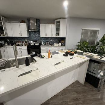 Cozymeal - kitchen set up for instructor with 6 students (3 couples) - Cooking Classes Near Me - Pasadena, California
