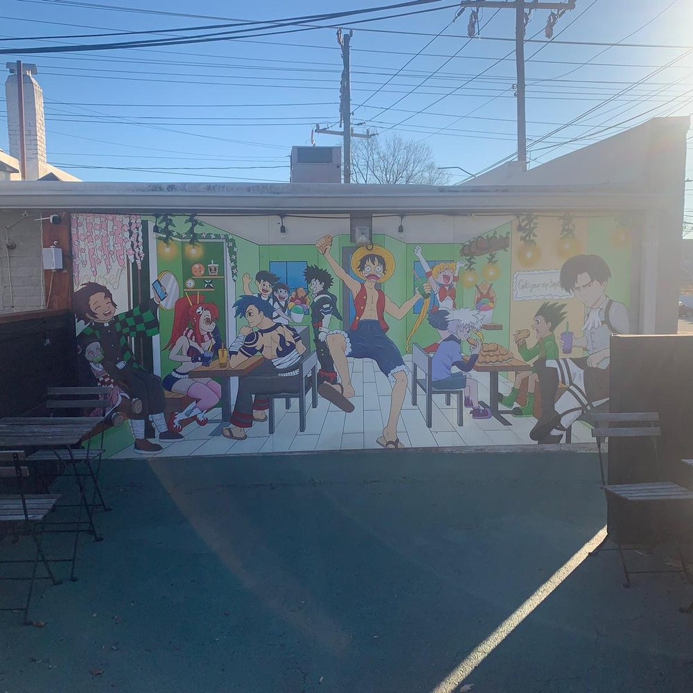 Moshi Moshi Boba Cafe - Mural outside on back of building with seating - Bubble Tea Near Me - Greensboro, North Carolina Moshi Moshi Boba Cafe - Mural outside on back of building with seating - Bubble Tea Near Me - Greensboro, North Carolina
