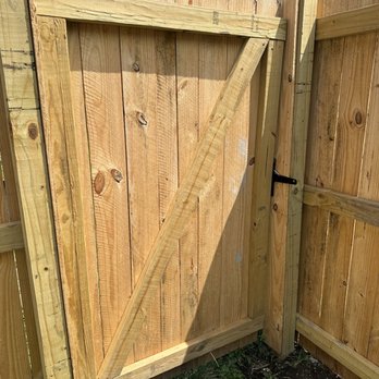 Midwest Pros - Post wrapped in wood to make up for incorrect measurements. Crooked gate opening. - Decks & Railing Near Me