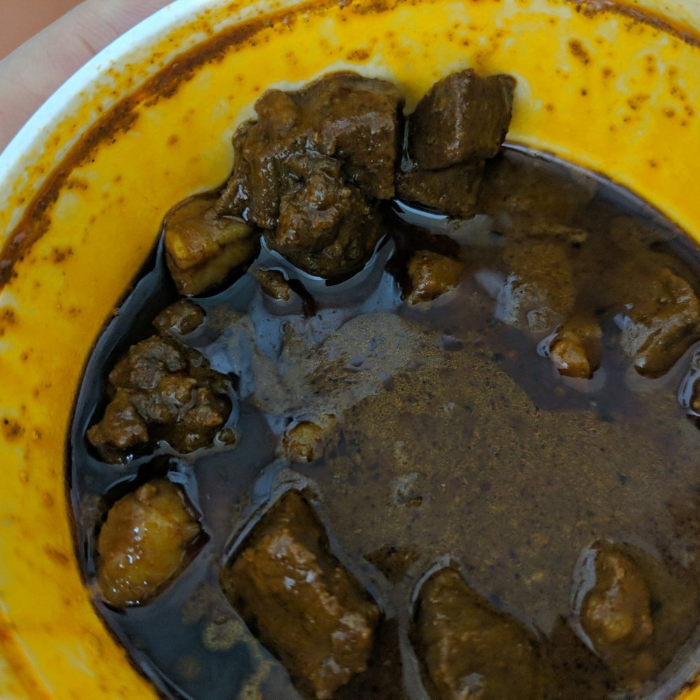 Confused Kitchen - Real generous mutton portions in the curry This picture is after I scooped out a bunch of chunks!!! - Burgers Near Me - Toronto, Ontario