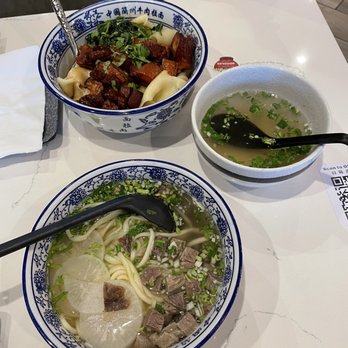 Highland Noodles - Lanzhou hand pull beef size small medium thin noodles (closer)  Pork belly topping soup noodles with wide flat noodles (Further out) - Noodles Near Me - Milpitas, California