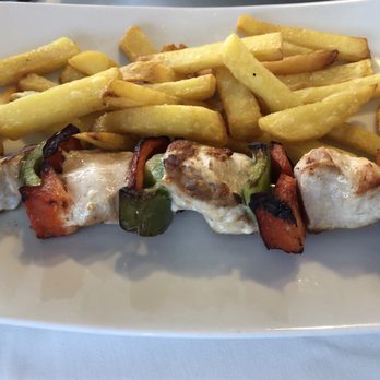 TORO Muelle Uno - Mediterranean chicken skewers - Spanish Near Me - Málaga, Massachusetts TORO Muelle Uno - Mediterranean chicken skewers - Spanish Near Me - Málaga, Massachusetts