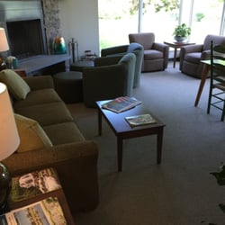 Sun and Ski Inn and Suites - A room off the lobby has a fireplace and games. The lobby had coffee and chairs.