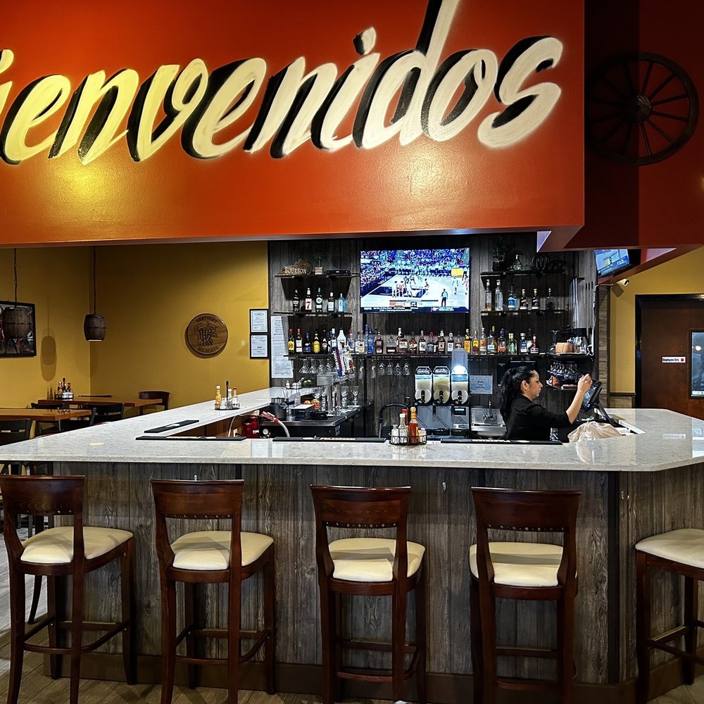 Viva Mexico Mexican Cuisine - a woman sitting at a bar - Mexican Near Me - Lexington, Kentucky Viva Mexico Mexican Cuisine - a woman sitting at a bar - Mexican Near Me - Lexington, Kentucky