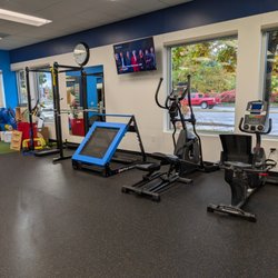 FYZICAL Therapy and Balance Centers - Salmon Creek - Strength and cardio equipment in the gym area.