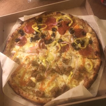 Blaze Pizza - regular crust, pesto sauce.Half pep/sausage, banana peppers, half olive, red onion, buffalo drizzle, well done. So good!! - Salad Near Me - Columbus, Ohio