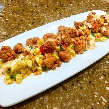 Corndance Tavern - Cajun Bayou Alligator on a bed of elote. - Bars Near Me - Mishawaka, Indiana Corndance Tavern - Cajun Bayou Alligator on a bed of elote. - Bars Near Me - Mishawaka, Indiana