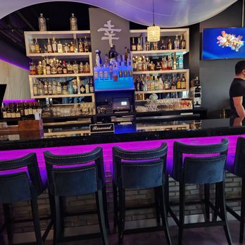 Shakou - Arlington Heights - a man standing at the bar - Sushi Bars Near Me - Arlington Heights, Illinois Shakou - Arlington Heights - a man standing at the bar - Sushi Bars Near Me - Arlington Heights, Illinois