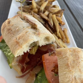 Local 1794 - a sandwich and french fries on a plate - Canadian (New) Near Me - Toronto, Ontario