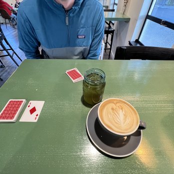 Junction Roastery - a cup of coffee and playing cards - Coffee Roasteries Near Me - Redmond, Oregon