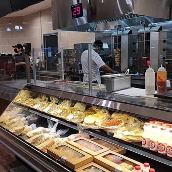 Arz Fine Foods - a man working in the kitchen - Lebanese Near Me - Mississauga, Ontario Arz Fine Foods - a man working in the kitchen - Lebanese Near Me - Mississauga, Ontario