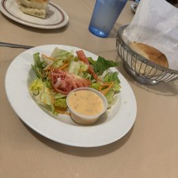 Salad with house dressing and the best garlic bread.