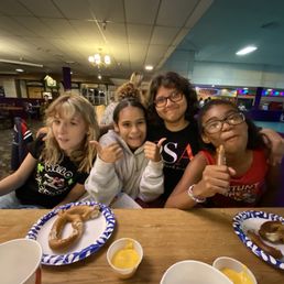 My kid and her friends. Eating pretzel with cheese. My kid and her friends. Eating pretzel with cheese.