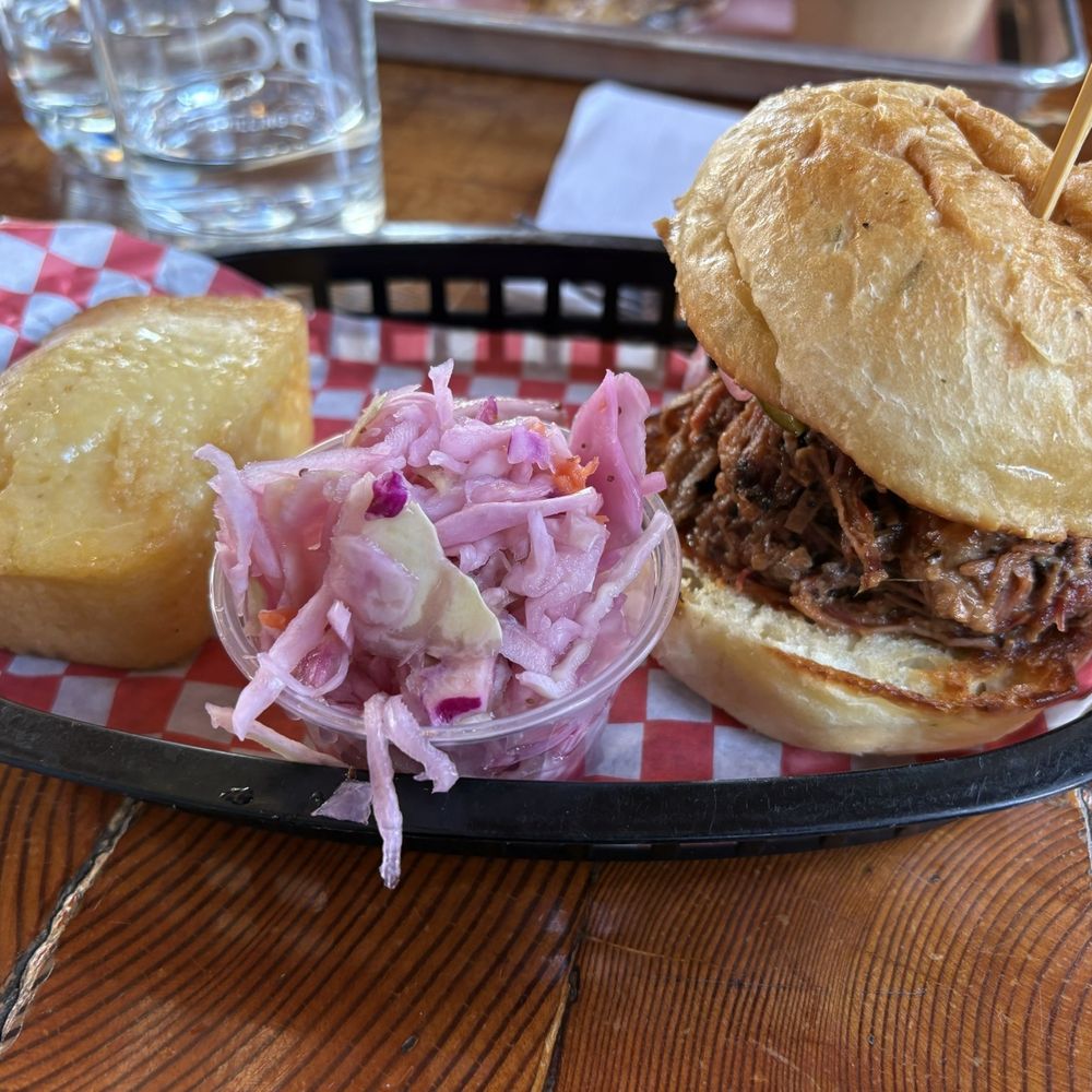 Beef brisket sandwich with coleslaw and cornbread