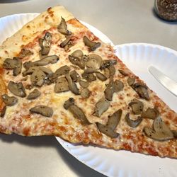 Benny Montanaro's - Garlic Mushroom Slice.  Canned mushrooms.  Boo.