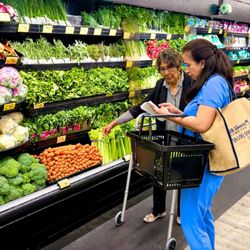 All Heart Home Care - Caregiver assisting with grocery shopping as part of everyday in-home support.