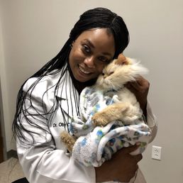 Dr. Okafor and Gizmo getting a quick snuggle after his exam!