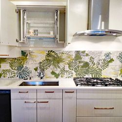 Signature Kitchens Additions & Baths - Our handy drip dry cabinet above a spacious kitchen sink.