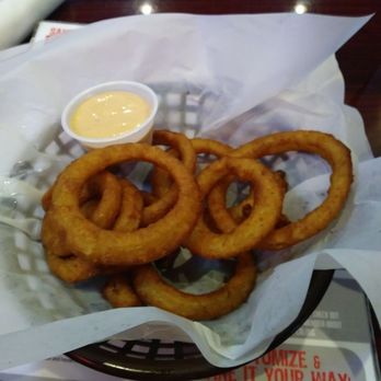 Angry Dog - Oniong rings are spot on. The sauce paurs up well with it. - Bars Near Me - Dallas, Texas Angry Dog - Oniong rings are spot on. The sauce paurs up well with it. - Bars Near Me - Dallas, Texas