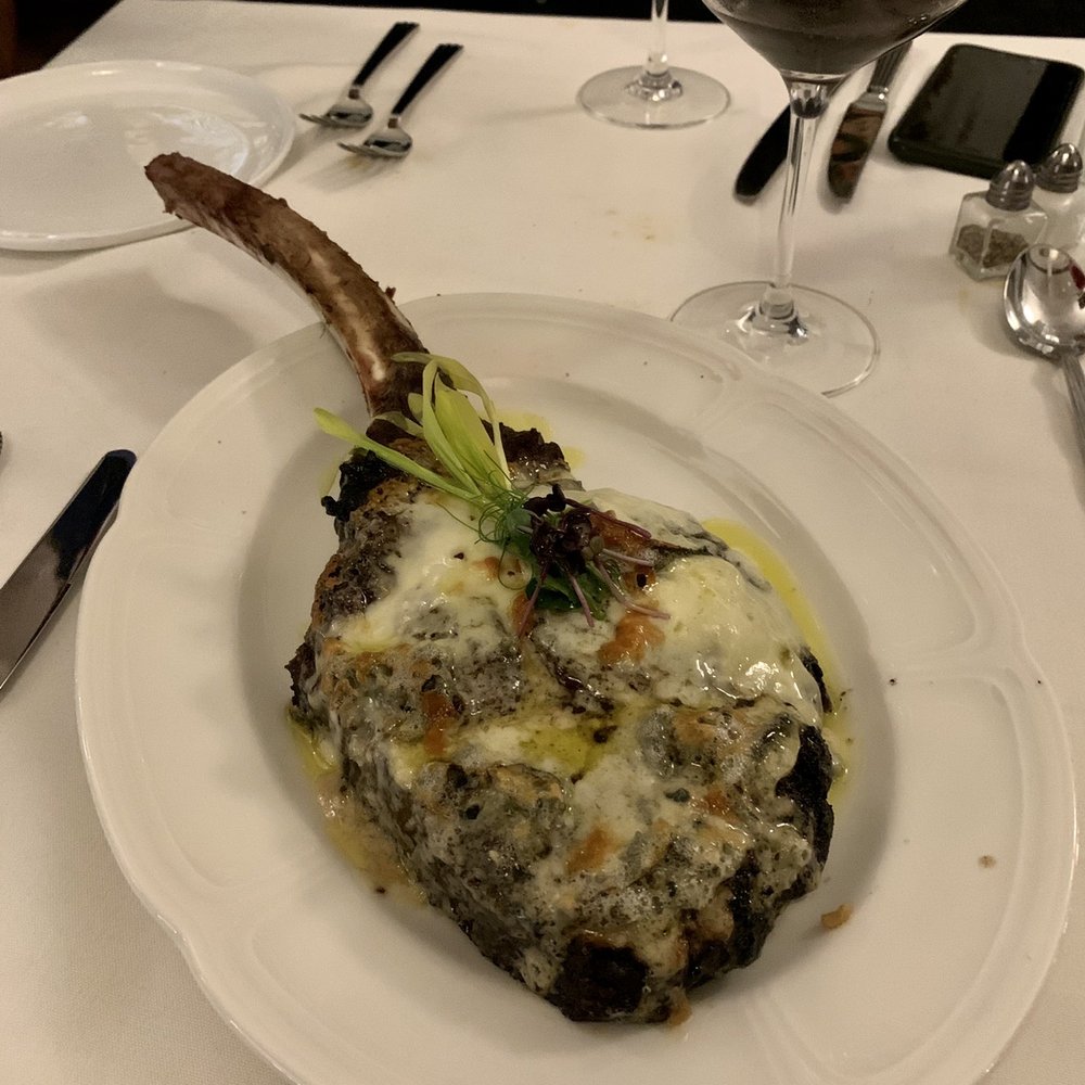 Prossimo Ristorante - Tomahawk steak with blue cheese topping - Italian Near Me - Tulsa, Oklahoma Prossimo Ristorante - Tomahawk steak with blue cheese topping - Italian Near Me - Tulsa, Oklahoma