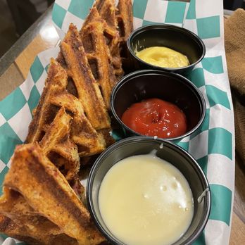 Cardboard Corner Cafe - Corn dog waffle with cheese dip, mustard and ketchup - Waffles Near Me - Overland Park, Kansas Cardboard Corner Cafe - Corn dog waffle with cheese dip, mustard and ketchup - Waffles Near Me - Overland Park, Kansas