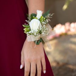 D & L Floral - Wristlet corsage. Two mini roses.