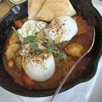 The Common - Park Slope - In the skillet - 3 Poached Eggs in Lebanese 5 Spice Stew - Breakfast & Brunch Near Me - Brooklyn, New York
