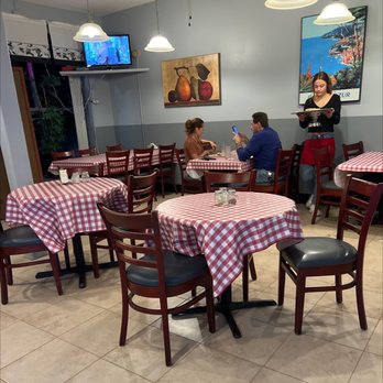 Europa Pizza & Restaurant - people sitting at tables with red and white checkered tablecloths - Pizza Near Me - Columbus, New Jersey Europa Pizza & Restaurant - people sitting at tables with red and white checkered tablecloths - Pizza Near Me - Columbus, New Jersey
